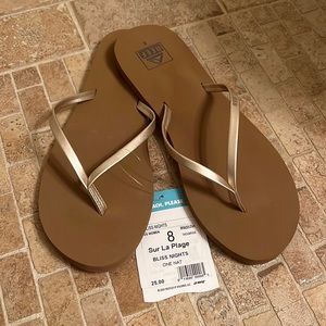 New with tags, Gold strap Reef flip flops